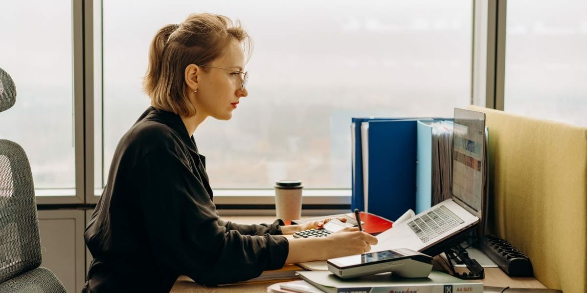 woman handling outsourced accounting services for a business