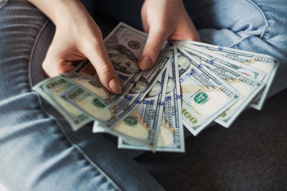 Business owner counting cash during a tax audit